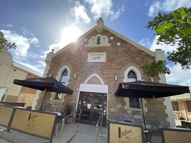 Cafe Safavi exterior in daylight with Vittoria umbrellas